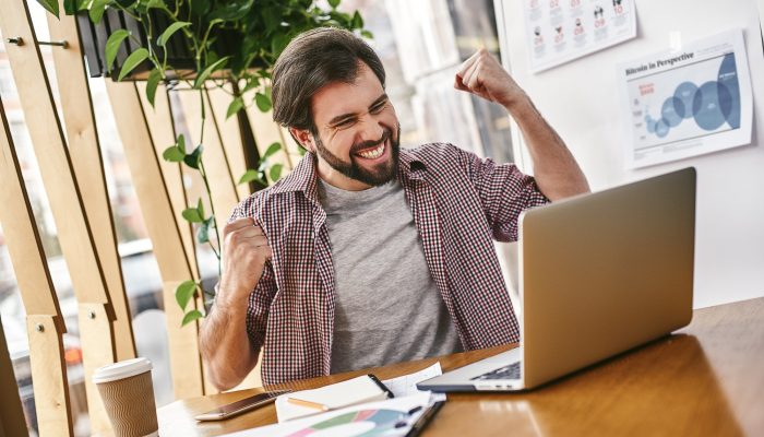 Stop chasing the money and start chasing the passion. Young businessman working on his laptop in