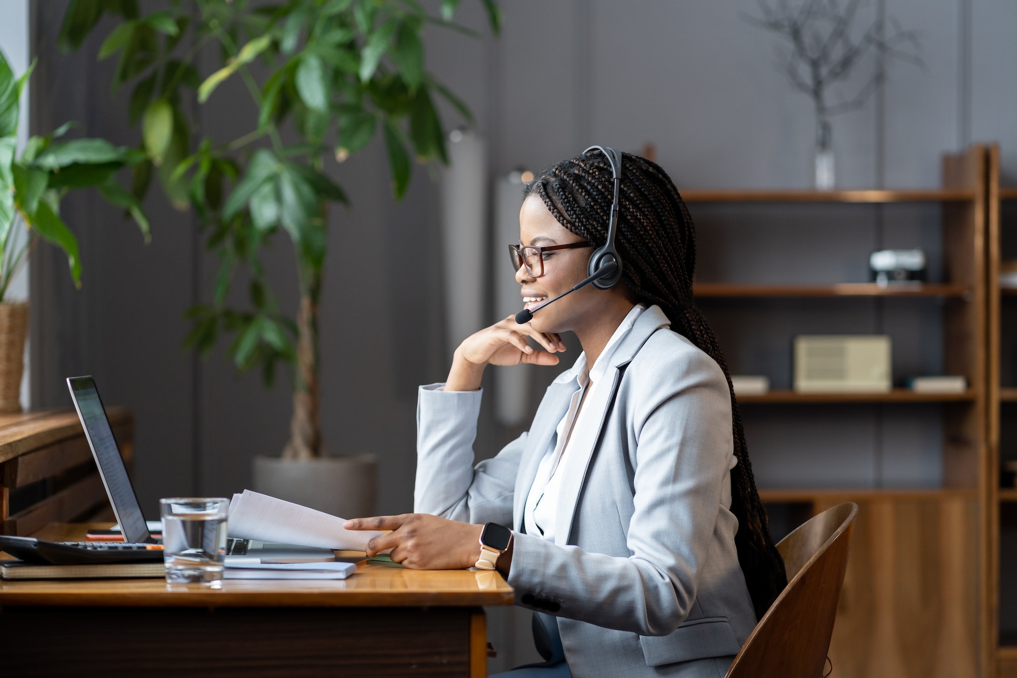 young-positive-african-woman-remote-recruiter-using-wireless-headset-to-communicate-with-candidates.jpg