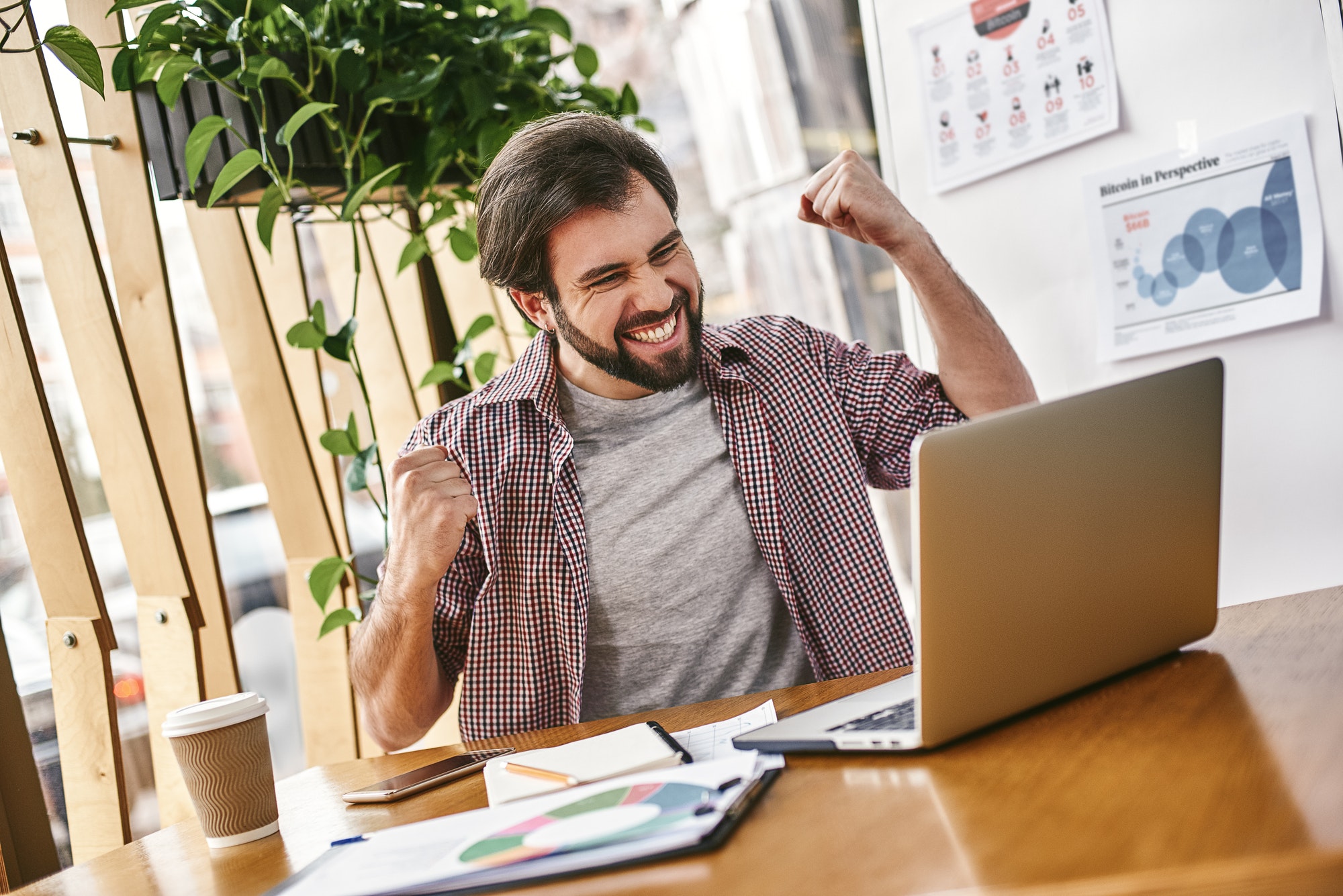 Stop chasing the money and start chasing the passion. Young businessman working on his laptop in
